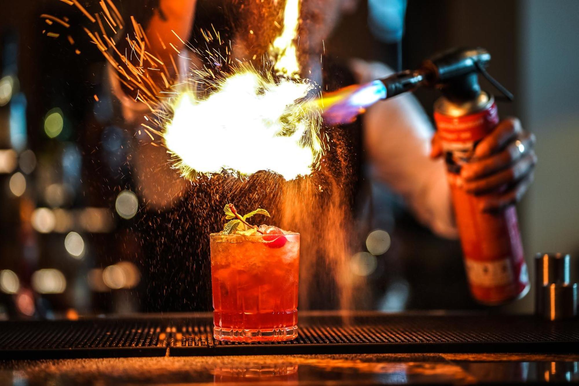 Waldorf Astoria Ras Al Khaimah Exterior photo Flaming a cocktail